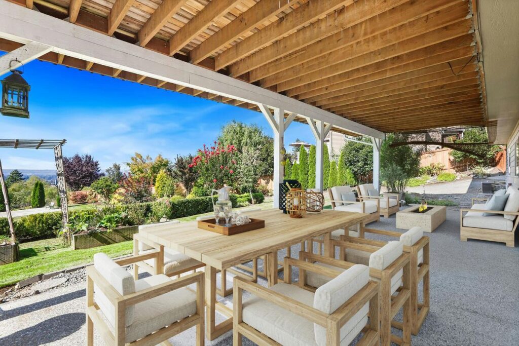 Covered timber pergola with outdoor dining setting