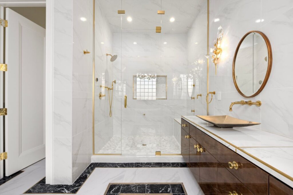 Renovated ensuite with frameless glass shower and timber vanity